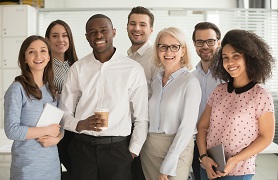 group of people standing professional attire