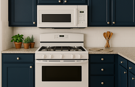 Kitchen with blue cabinets with white stove and white microwave overtop.  Countertops granite with potted herbs, pot holders and jar of spoons on top.