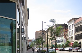 city street with row of commercial buildings